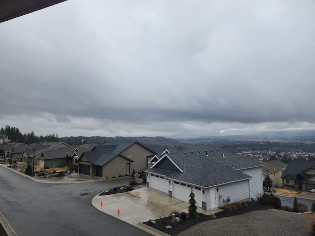 view of street with curbs and a residential view