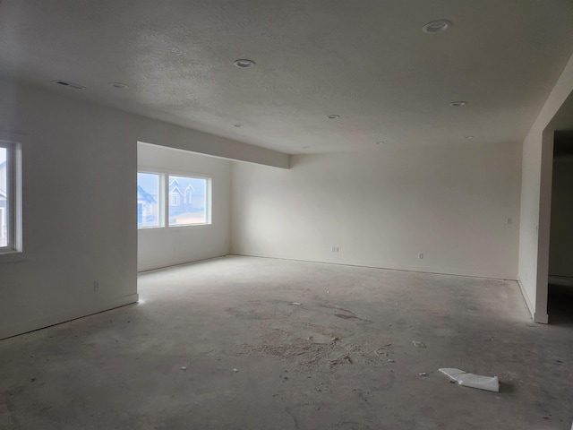 spare room with visible vents and a textured ceiling