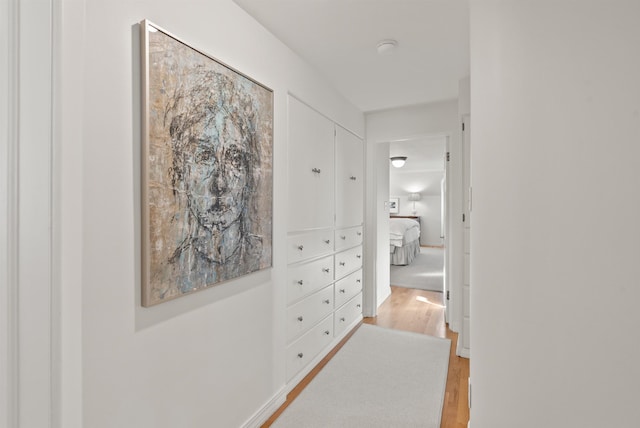 hallway with light wood-style flooring