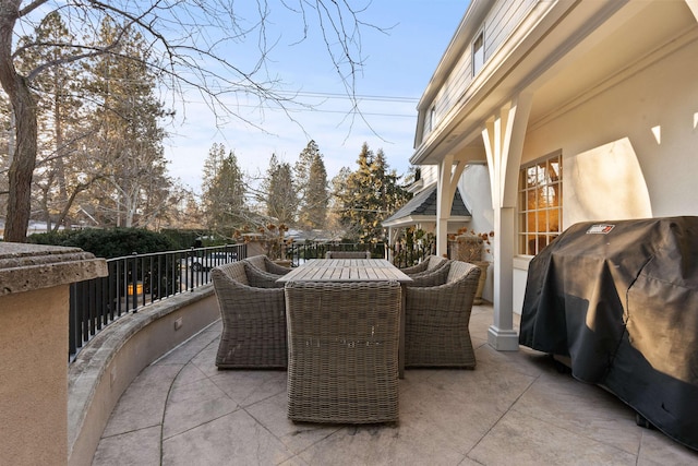 view of patio with a grill and outdoor dining space