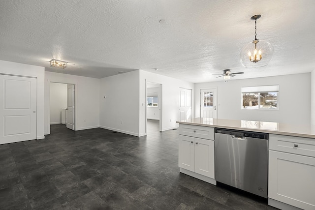 kitchen featuring ceiling fan, light countertops, white cabinets, stainless steel dishwasher, and open floor plan