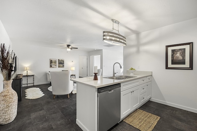 kitchen with dishwasher, baseboards, a peninsula, and a sink