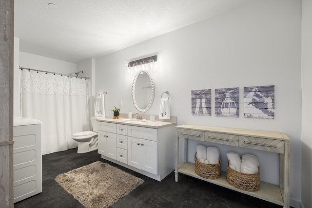 full bath with washer / clothes dryer, toilet, concrete floors, and vanity