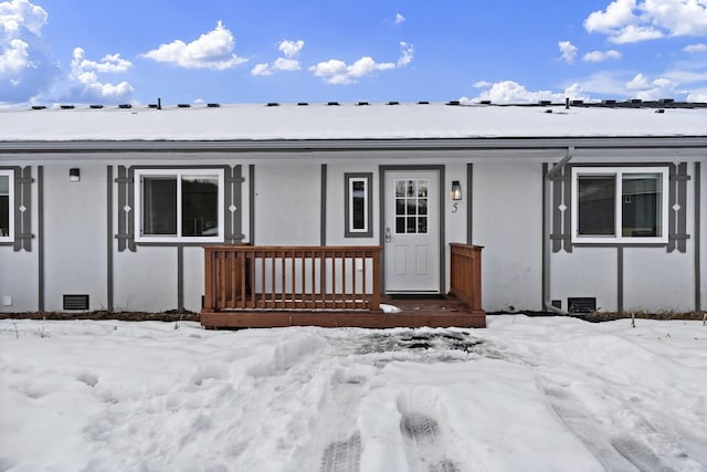 view of front of home featuring a porch, crawl space, and stucco siding