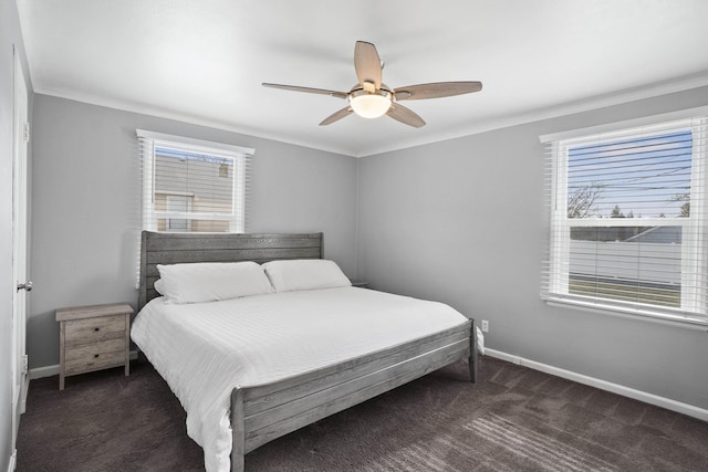 bedroom with a ceiling fan, carpet, and baseboards