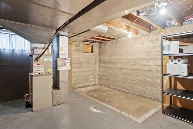 unfinished basement with heating unit