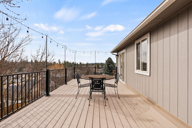 deck with outdoor dining area