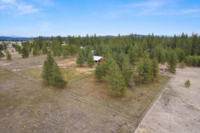 bird's eye view with a mountain view and a view of trees