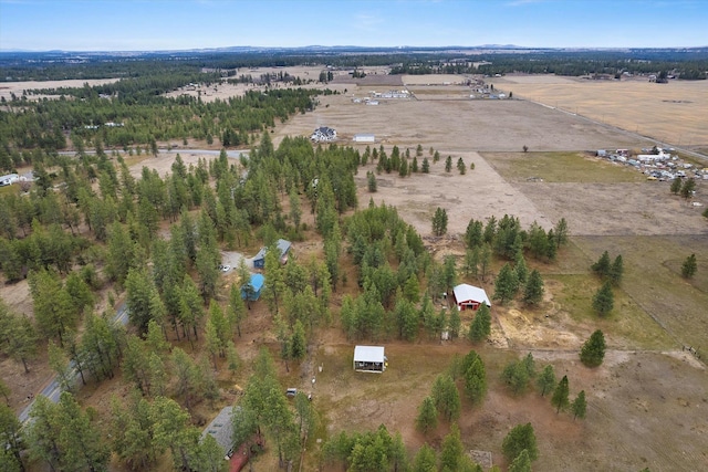 birds eye view of property featuring a rural view