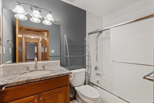 bathroom with toilet, vanity, and washtub / shower combination