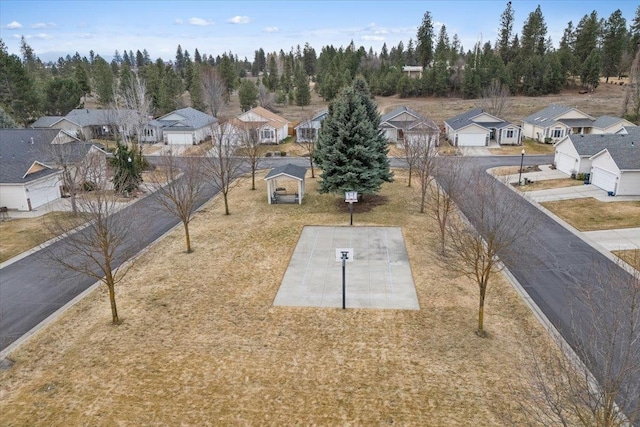 birds eye view of property with a residential view