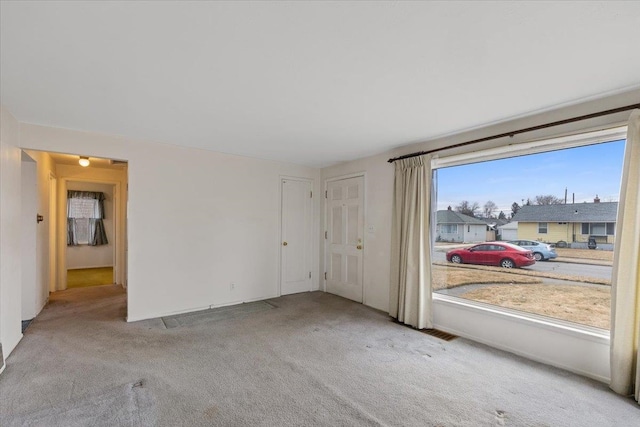 unfurnished room featuring carpet