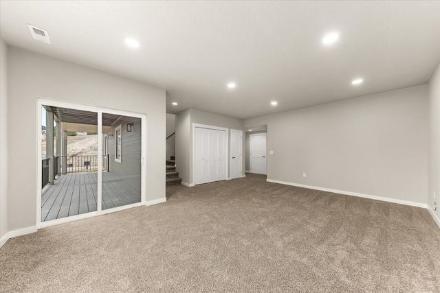 interior space featuring visible vents, recessed lighting, stairway, and baseboards