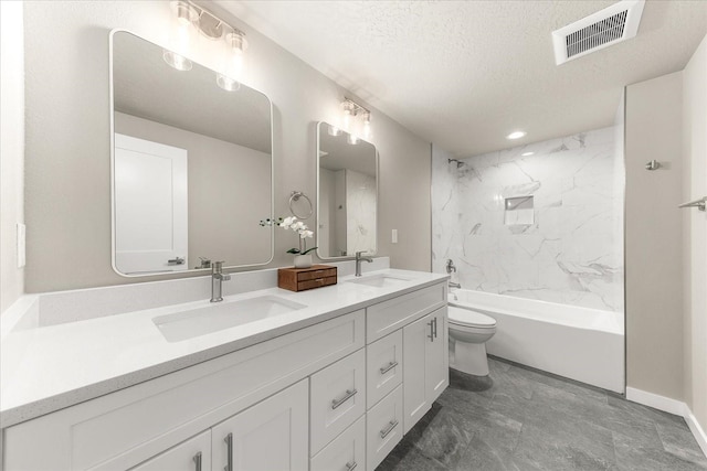 full bath featuring double vanity, visible vents, toilet, and a sink