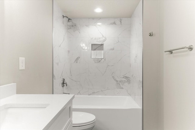 bathroom featuring recessed lighting, toilet, bathtub / shower combination, and vanity