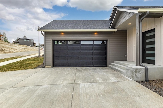 garage with concrete driveway