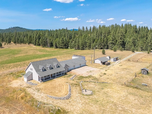 aerial view featuring a rural view and a forest view