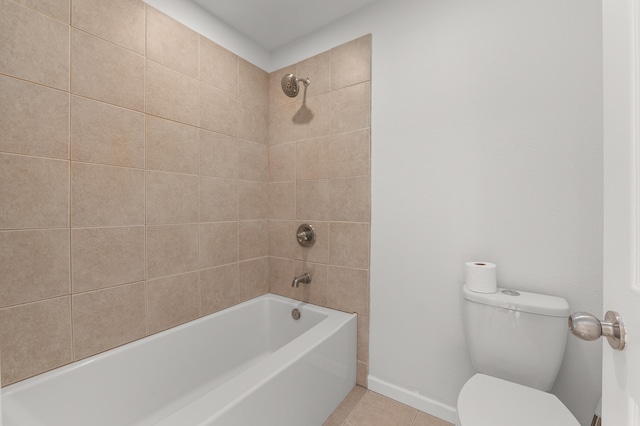 bathroom with bathtub / shower combination, tile patterned floors, toilet, and baseboards