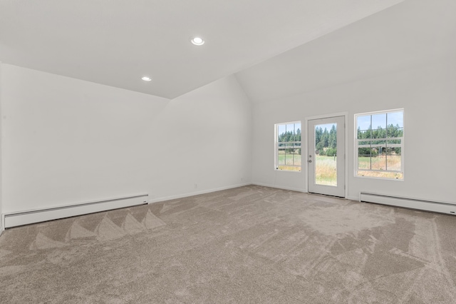 empty room with carpet flooring, a baseboard heating unit, lofted ceiling, and a baseboard radiator