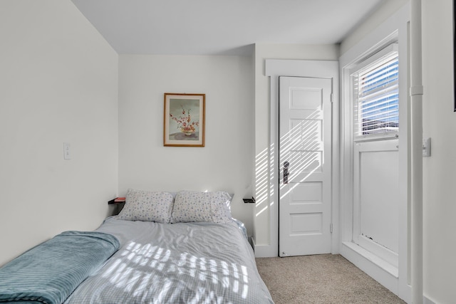 bedroom with light carpet