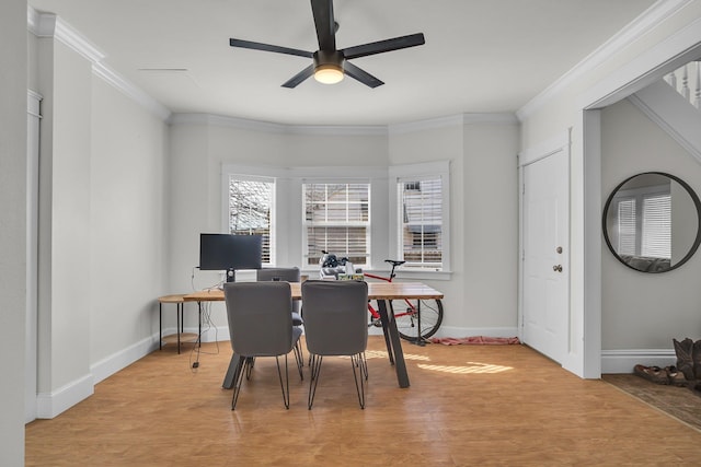 office area featuring light wood finished floors, a ceiling fan, crown molding, and baseboards