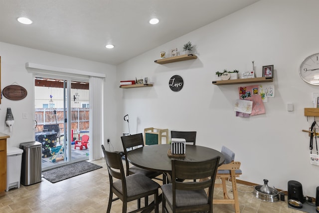 dining space featuring recessed lighting and vaulted ceiling