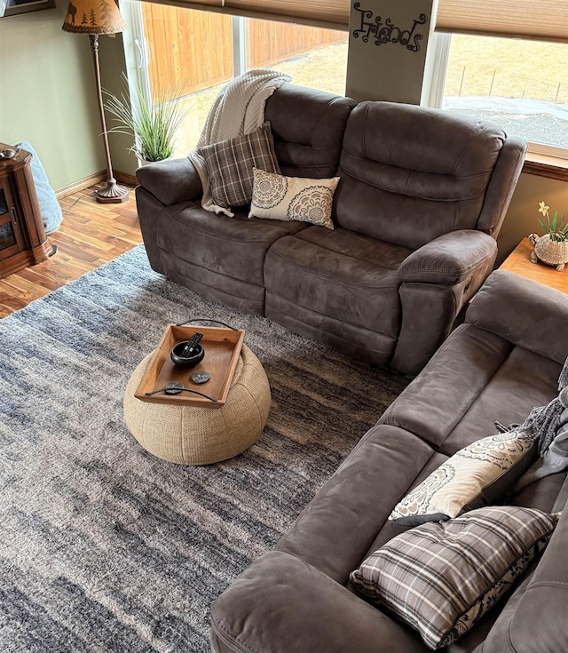 living area featuring wood finished floors and baseboards