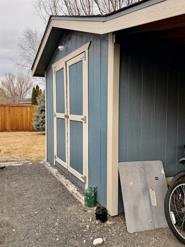 view of shed with fence