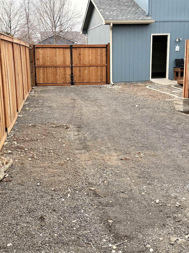 view of yard featuring a gate and fence