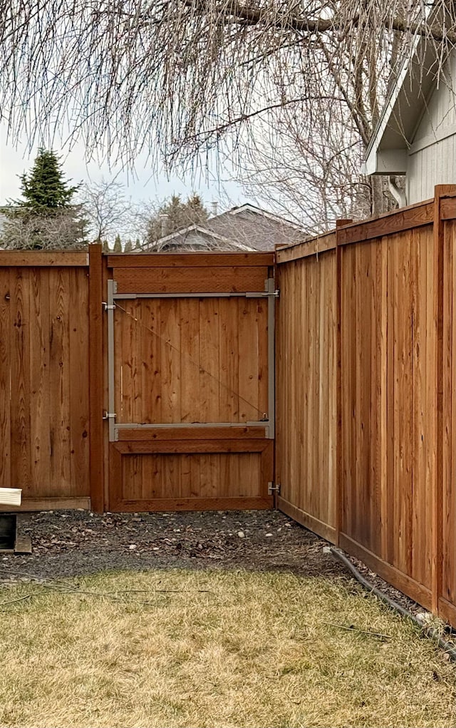 view of gate featuring fence