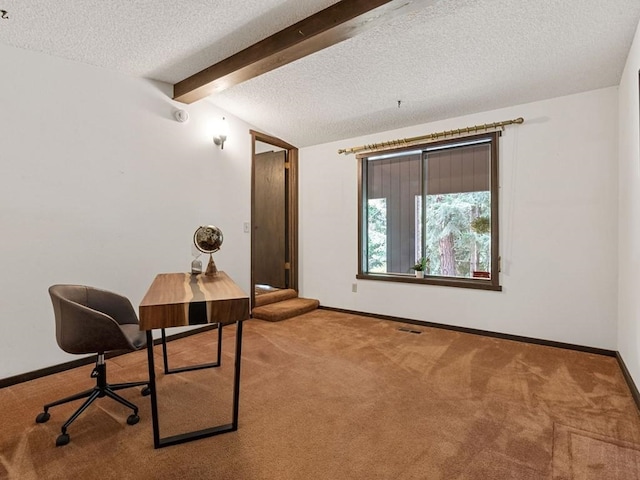 office space featuring baseboards, a textured ceiling, vaulted ceiling with beams, and carpet flooring