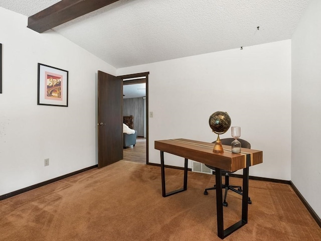 carpeted home office featuring vaulted ceiling with beams, baseboards, and a textured ceiling