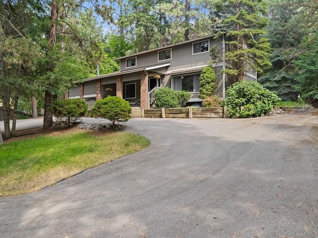 view of front of property with aphalt driveway and brick siding