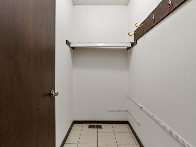 walk in closet featuring visible vents and light tile patterned flooring