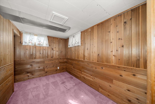 basement featuring wooden walls, a sauna, and carpet