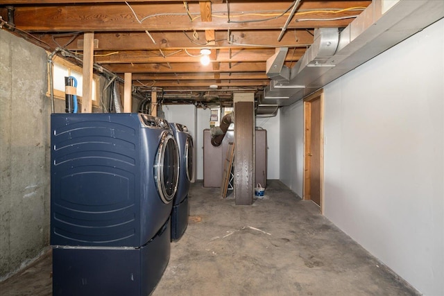 unfinished basement featuring washer and clothes dryer