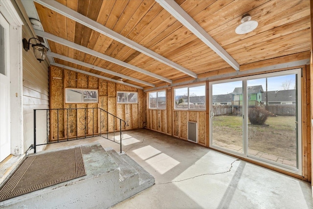 unfurnished sunroom with wooden ceiling and lofted ceiling with beams