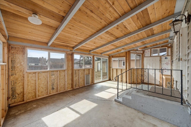 interior space with vaulted ceiling with beams