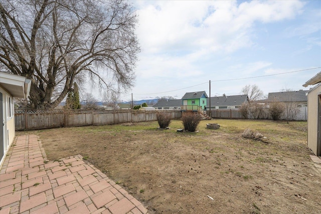 view of yard featuring a patio area and a fenced backyard