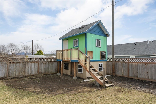 view of jungle gym featuring stairs and a fenced backyard