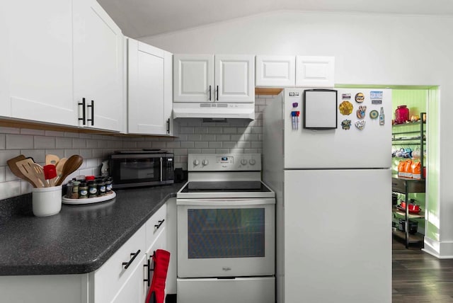 kitchen with white appliances, vaulted ceiling, under cabinet range hood, white cabinetry, and tasteful backsplash