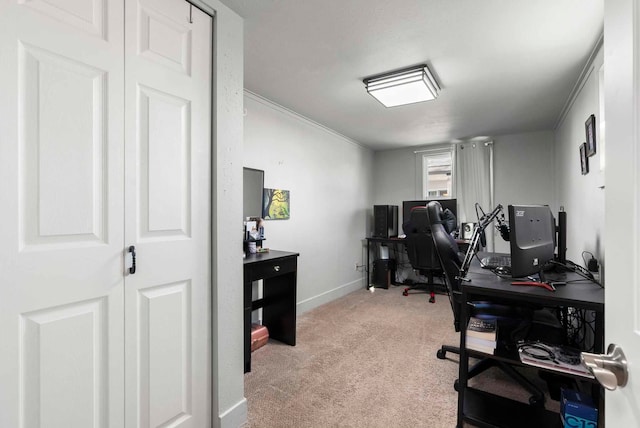 home office with baseboards, light colored carpet, and crown molding