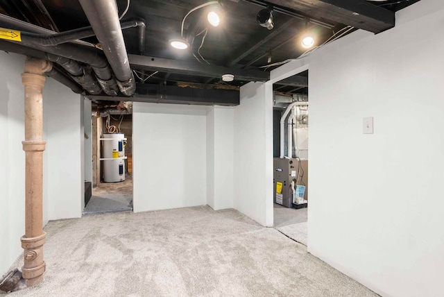 unfinished basement featuring heating unit, carpet floors, and water heater