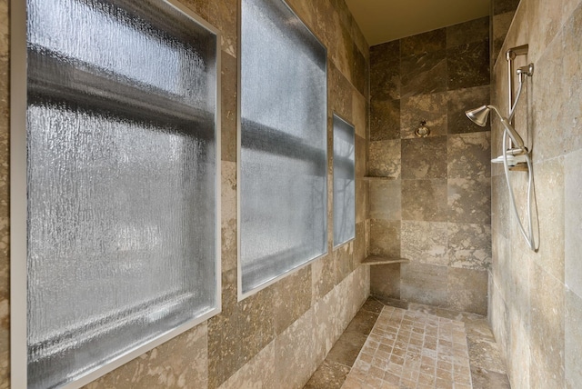 full bathroom with tiled shower