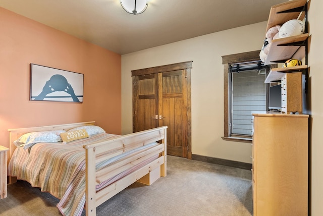 carpeted bedroom with baseboards