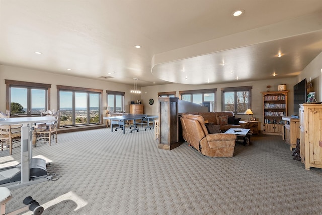 living room with recessed lighting and carpet floors