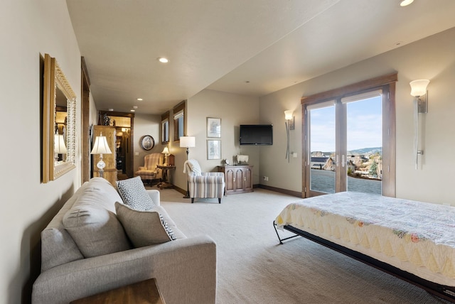 bedroom with access to exterior, recessed lighting, baseboards, and light carpet