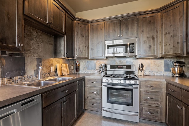 kitchen featuring tasteful backsplash, dark brown cabinets, stainless steel appliances, and a sink