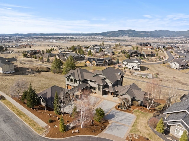 birds eye view of property featuring a mountain view and a residential view