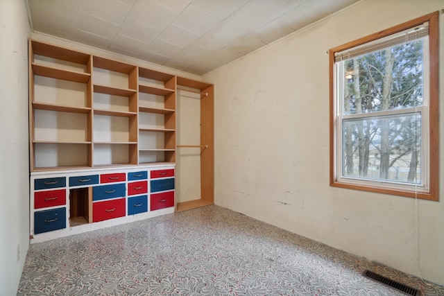 unfurnished bedroom featuring visible vents